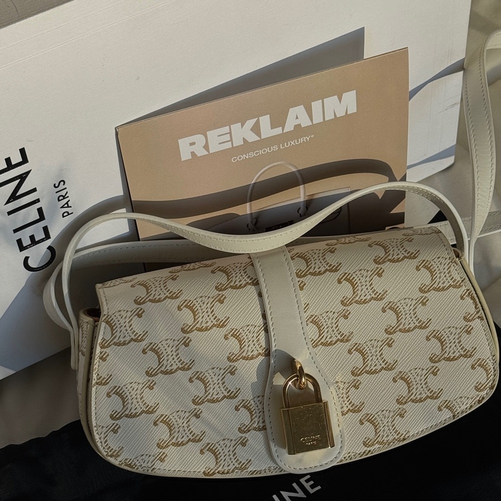 Cream Celine Triomphe mini bag with gold hardware and lock